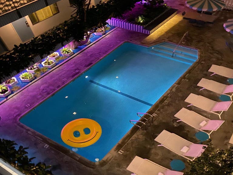 Smiley face floatie in the pool at the Beverly Laurel Motor Hotel