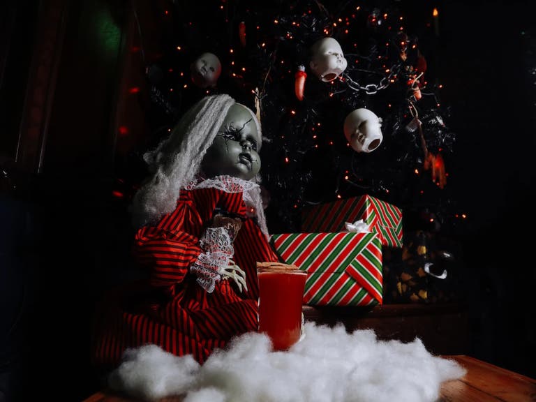 Doll under the Christmas tree at Krampus' Cove